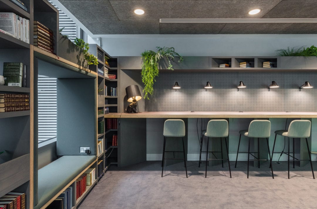 Library themed workplace seating area in The Living Rooms